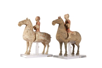 Lot 357 - TWO CHINESE POTTERY HORSES AND RIDERS.