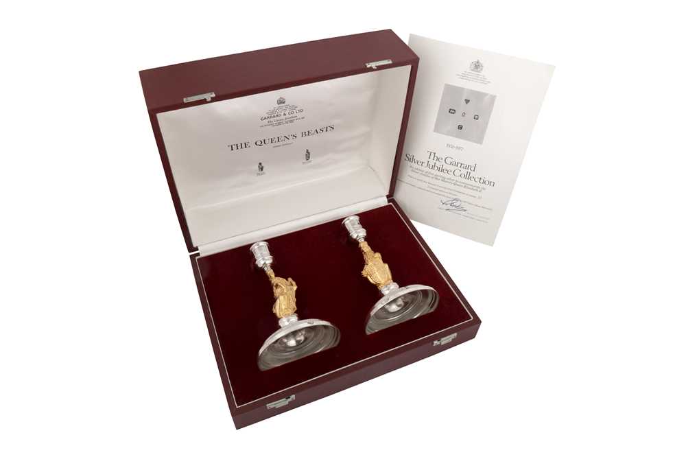 Lot 546 - A cased pair of Elizabeth II parcel gilt sterling silver commemorative candlesticks, London 1977 by Garrard and Co