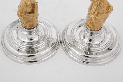 Lot 546 - A cased pair of Elizabeth II parcel gilt sterling silver commemorative candlesticks, London 1977 by Garrard and Co