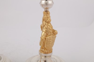 Lot 546 - A cased pair of Elizabeth II parcel gilt sterling silver commemorative candlesticks, London 1977 by Garrard and Co