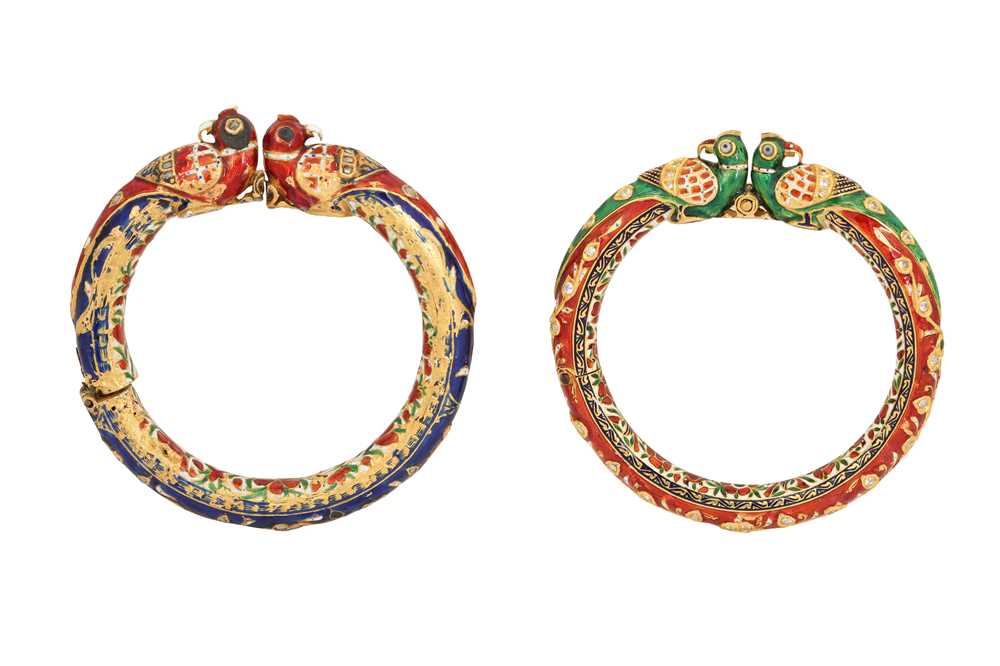 Lot 363 - TWO GILT AND POLYCHROME-ENAMELLED BANGLES WITH PARROT HEADS