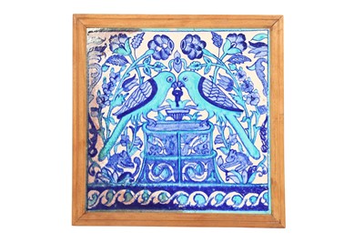 Lot 518 - A FRAMED TURQUOISE AND COBALT BLUE MULTAN POTTERY TILE WITH PARROTS