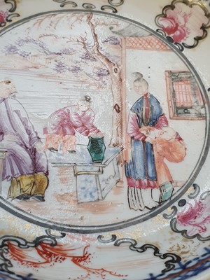 Lot 595 - A PAIR OF CHINESE FAMILLE ROSE FIGURATIVE SAUCER DISHES.