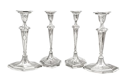 Lot 655 - A set of four George III sterling silver candlesticks, Sheffield 1788 by George Ashforth & Co, two overstruck by Thomas Daniell of London