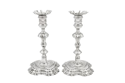 Lot 700 - A pair of George II sterling silver candlesticks, London 1750 by John Cafe