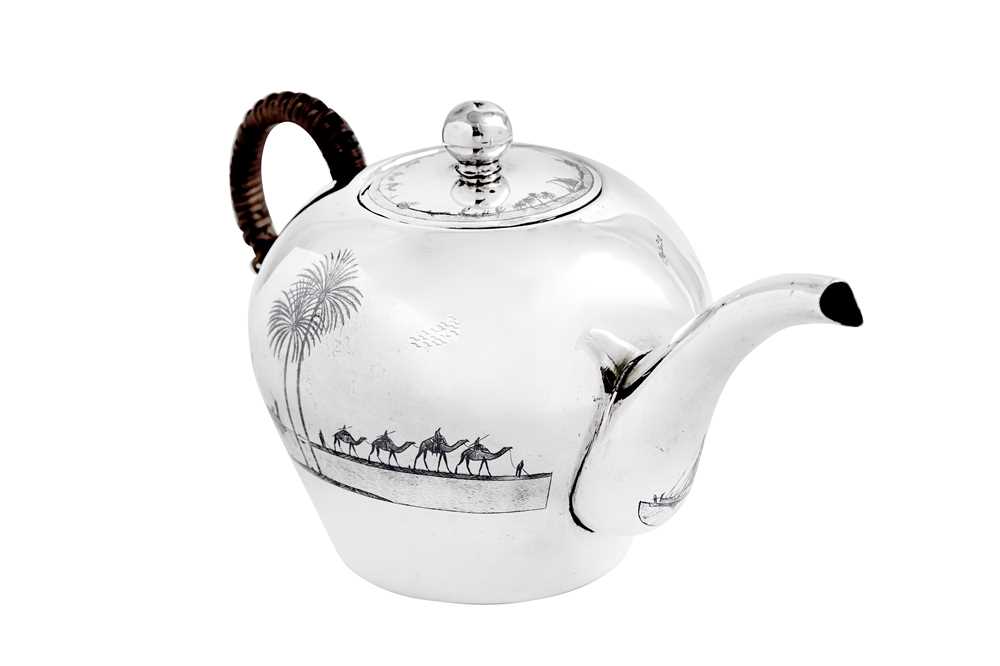 Lot 370 - An early 20th century Iraqi silver and niello teapot, circa 1930 signed Omara, Amer, Raheem