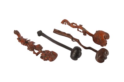 Lot 645 - FOUR CHINESE WOOD RUYI SCEPTRES.