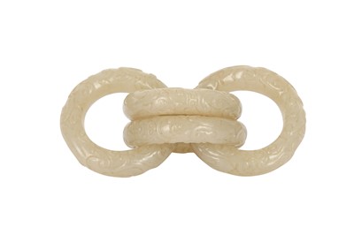 Lot 917 - FOUR CHINESE CARVED WHITE JADE CONJOINED RINGS.