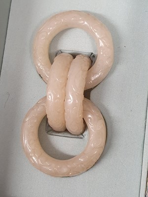 Lot 917 - FOUR CHINESE CARVED WHITE JADE CONJOINED RINGS.