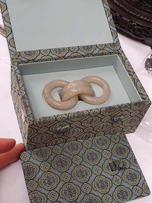 Lot 917 - FOUR CHINESE CARVED WHITE JADE CONJOINED RINGS.