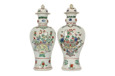 Lot 128 - A NEAR-PAIR OF CHINESE FAMILLE VERTE BALUSTER VASES AND COVERS.