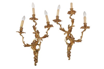 Lot 206 - A PAIR OF FRENCH GILT BRONZE THREE LIGHT WALL APPLIQUES, IN THE LOUIS XV STYLE, 20TH CENTURY