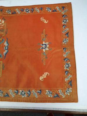 Lot 381 - A PAIR OF CHINESE EMBROIDERED RED-GROUND CHAIR COVERS.
