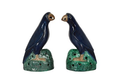 Lot 281 - A PAIR OF CHINESE NAVY BLUE-GLAZED PARROTS.