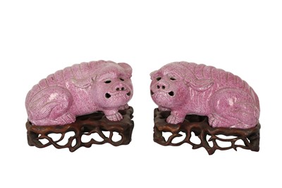 Lot 745 - A PAIR OF PINK-SPECKLE-GLAZED LION DOG PUPPIES.