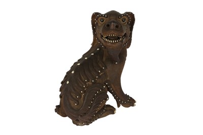 Lot 749 - A CHINESE SHIWAN MODEL OF A LION DOG.