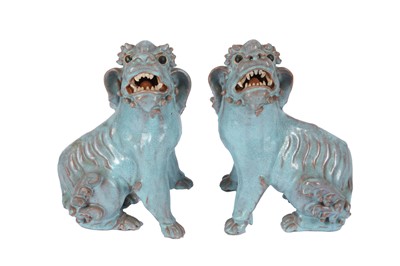 Lot 1032 - A PAIR OF CHINESE TURQUOISE-GLAZED LION DOGS.