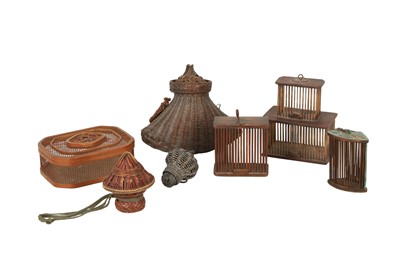 Lot 811 - A COLLECTION OF SEVEN WOVEN AND CARVED WOOD CRICKET CAGES.