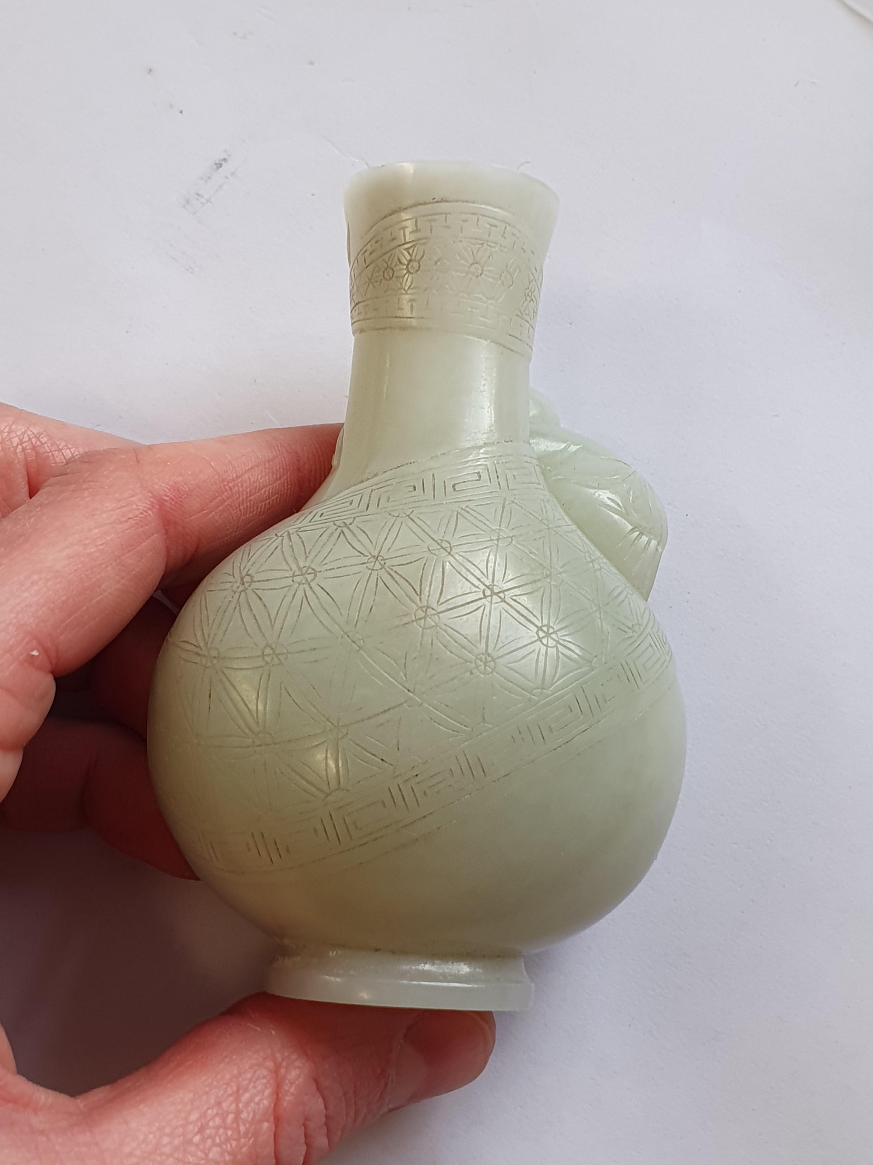Lot 367 A CHINESE PALE CELADON JADE MINIATURE VASE.