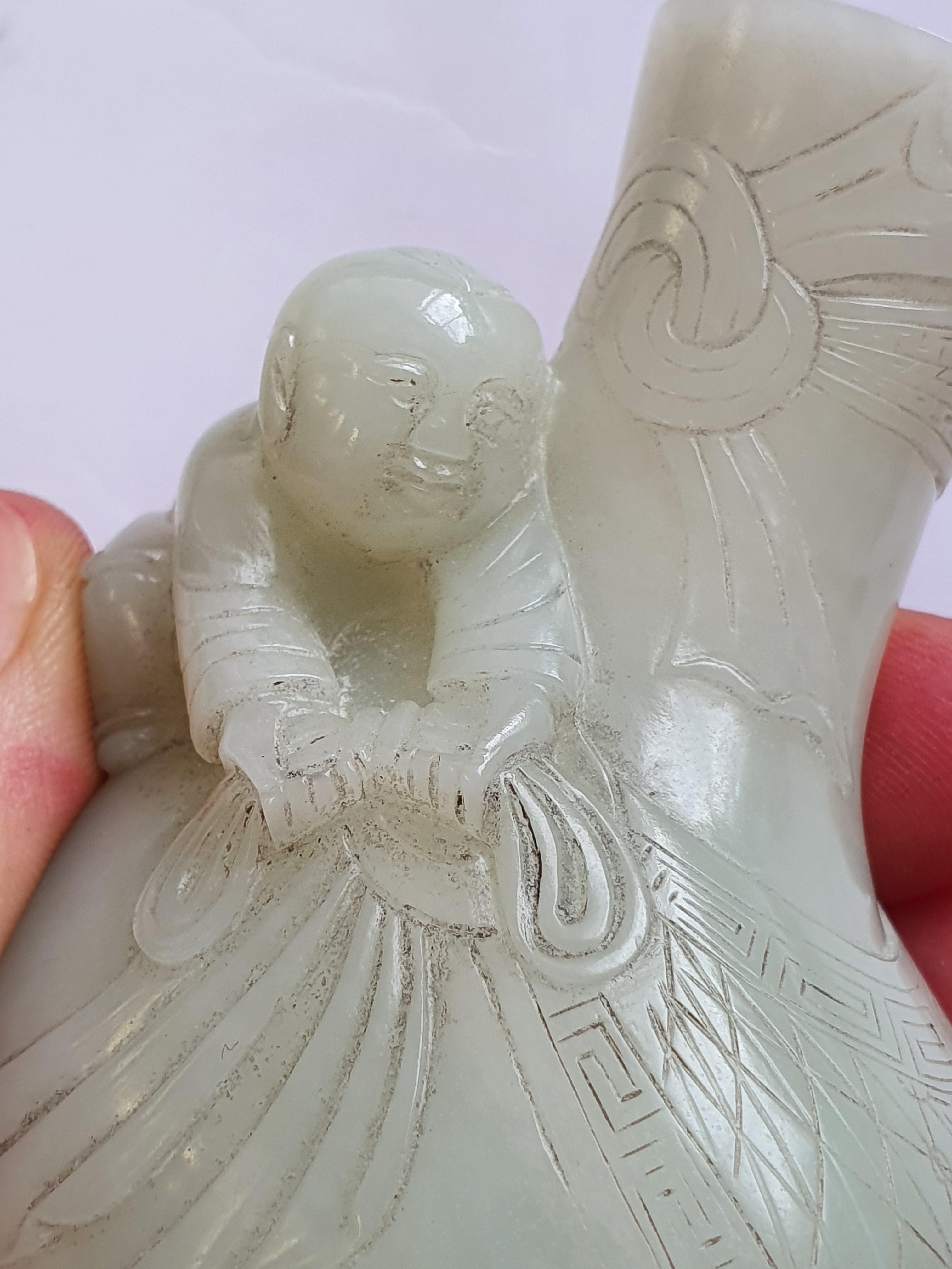 Lot 367 A CHINESE PALE CELADON JADE MINIATURE VASE.