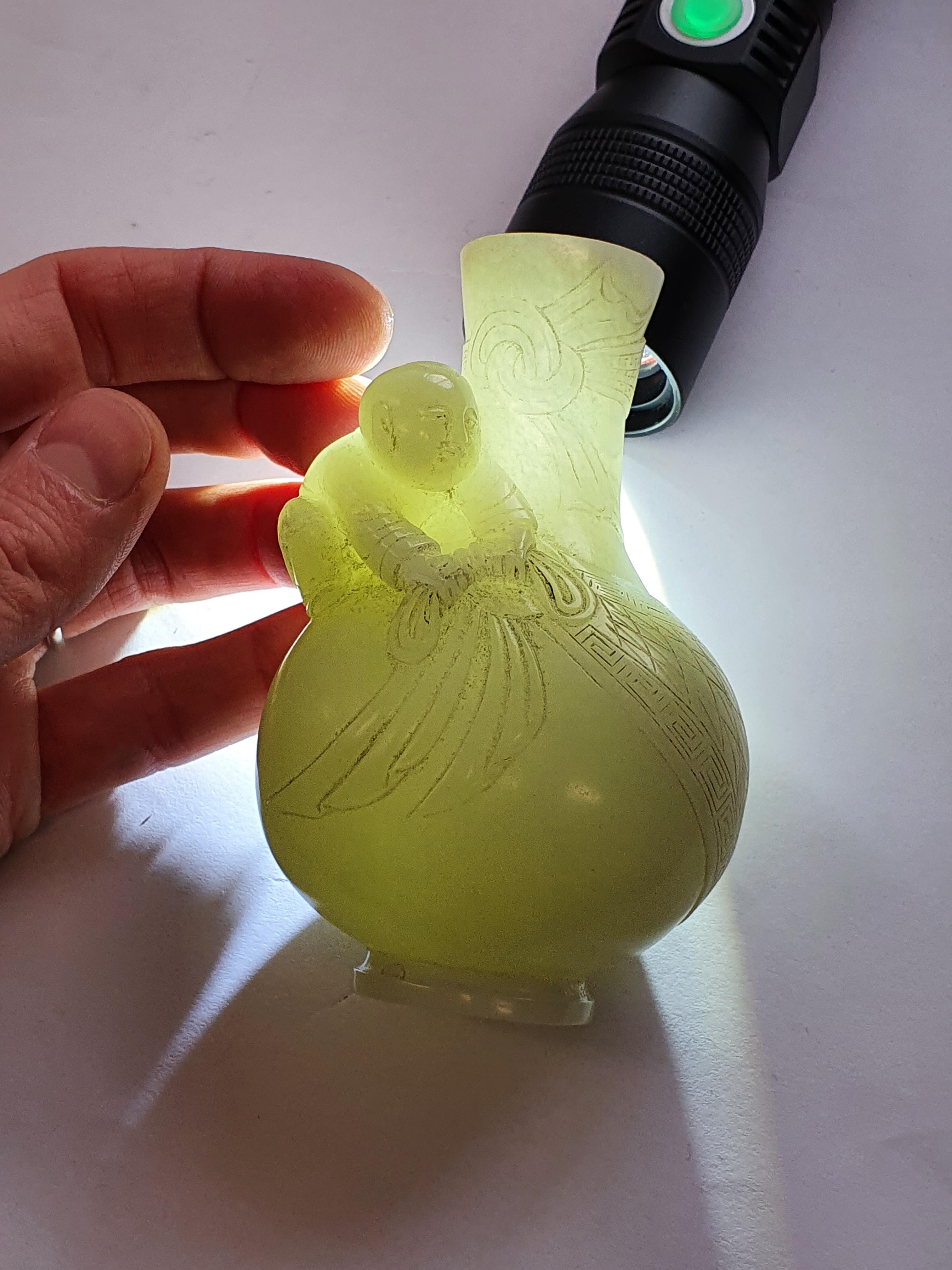 Lot 367 A CHINESE PALE CELADON JADE MINIATURE VASE.