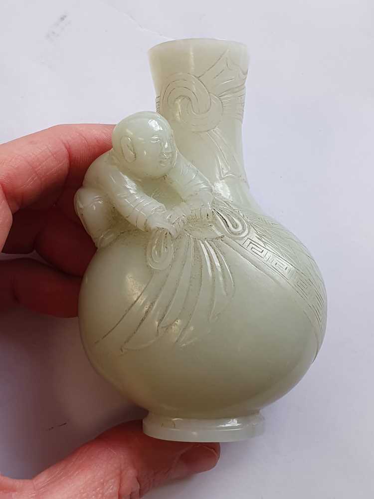 Lot 367 A CHINESE PALE CELADON JADE MINIATURE VASE.