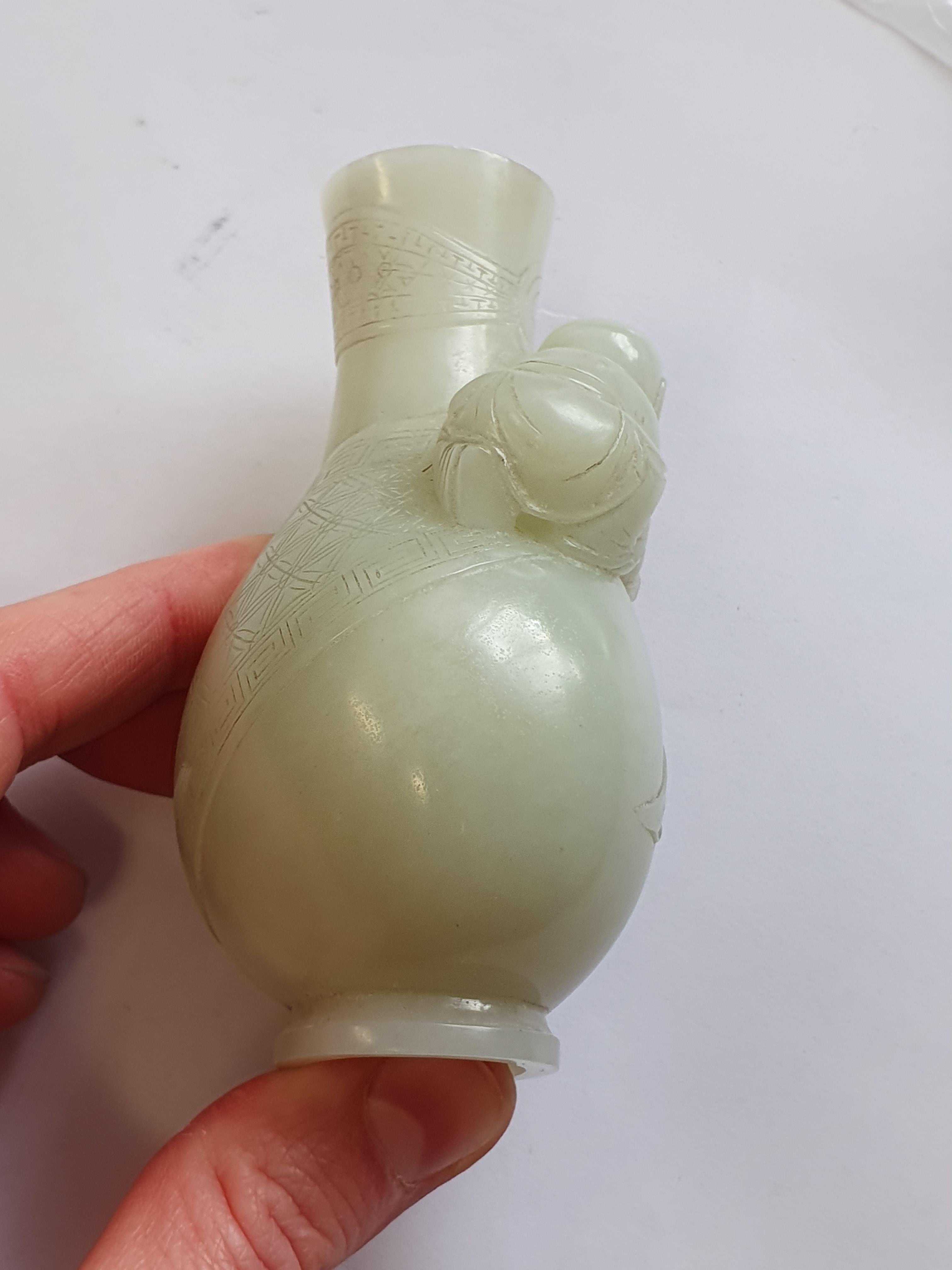 Lot 367 A CHINESE PALE CELADON JADE MINIATURE VASE.