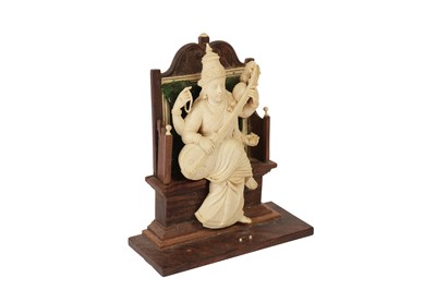 Lot 601 - λ AN INDIAN IVORY SCULPTURE OF A FOUR ARMED FEMALE DEITY, LATE 19TH/EARLY 20TH CENTURY
