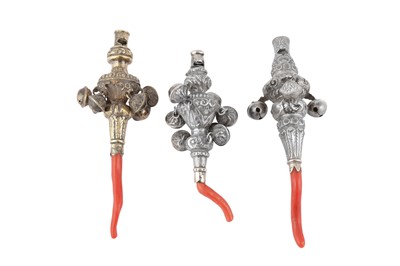Lot 62 - A mixed group of William IV / Victorian sterling silver and coral baby’s rattles