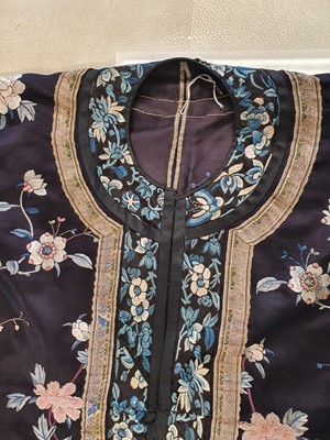 Lot 292 - A CHINESE EMBROIDERED BLUE-GROUND LADY'S ROBE.