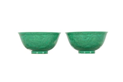 Lot 1029 - A PAIR OF CHINESE INCISED GREEN-GLAZED 'DRAGON' BOWLS.