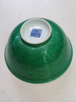 Lot 123 - A PAIR OF CHINESE INCISED GREEN-GLAZED 'DRAGON' BOWLS.
