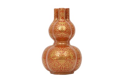 Lot 658 - A CHINESE CORAL-GROUND GILT-DECORATED TRIPPLE-NECKED GOURD VASE.