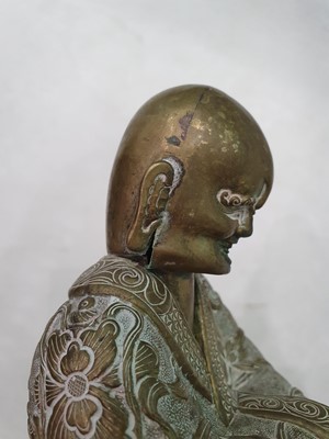 Lot 608 - A CHINESE BRONZE FIGURE OF A LUOHAN.