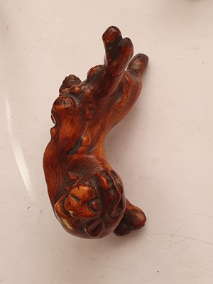 Lot 635 - A PAIR OF CHINESE BURLWOOD LIONS.