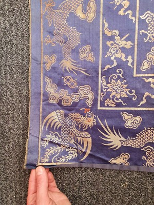 Lot 385 - A CHINESE BLUE-GROUND SILK 'DRAGON' PANEL.