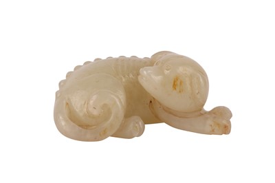Lot 696 - A CHINESE PALE CELADON JADE MODEL OF A DOG.