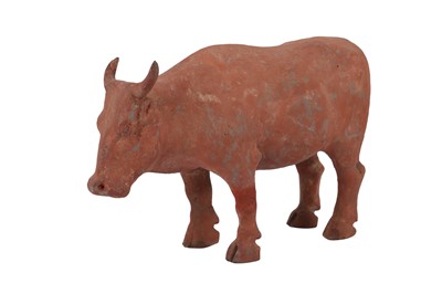 Lot 1109 - A CHINESE POTTERY MODEL OF A BULL, HAN DYNASTY