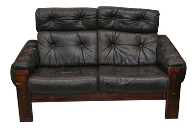 Lot 478 - MANNER OF LEOLUX, A PAIR OF STAINED BEECH TWO SEATER SOFAS, CIRCA 1980S