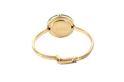 Lot 283 - Gucci Gold Interchangeable Bezel Bangle Watch