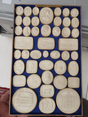 Lot 86 - A COLLECTION OF FOUR TRAYS OF GRAND TOUR PLASTER INTAGLIOS, 19TH CENTURY