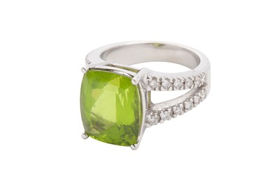 Lot 120 - A peridot and diamond dress ring