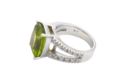 Lot 120 - A peridot and diamond dress ring