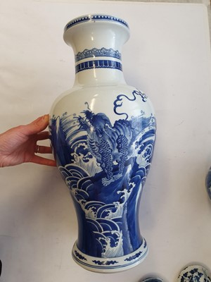 Lot 137 - A CHINESE BLUE AND WHITE 'QILIN ON ROCKS' BALUSTER VASE.