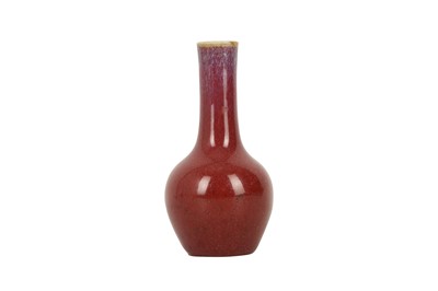 Lot 1037 - A SMALL CHINESE FLAMBÉ BOTTLE VASE.