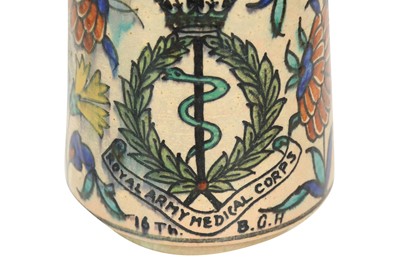 Lot 717 - A PALESTINIAN IZNIK-STYLE POTTERY MUG WITH THE BRITISH ROYAL ARMY MEDICAL CORPS EMBLEM