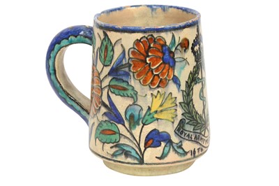 Lot 717 - A PALESTINIAN IZNIK-STYLE POTTERY MUG WITH THE BRITISH ROYAL ARMY MEDICAL CORPS EMBLEM