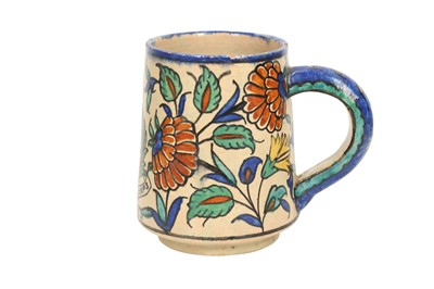 Lot 717 - A PALESTINIAN IZNIK-STYLE POTTERY MUG WITH THE BRITISH ROYAL ARMY MEDICAL CORPS EMBLEM