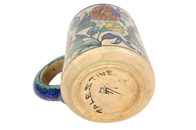 Lot 717 - A PALESTINIAN IZNIK-STYLE POTTERY MUG WITH THE BRITISH ROYAL ARMY MEDICAL CORPS EMBLEM