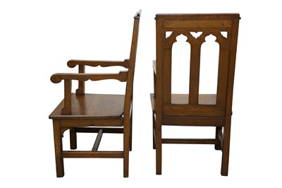 Lot 132 - A PAIR OF EARLY 20TH CENTURY ECCLESIASTICAL OAK ARMCHAIRS